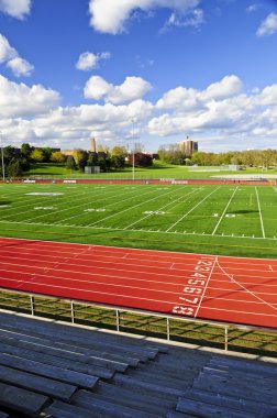 Wide angle view of public outdoor athletic stadium clipart