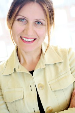 Portrait of a mature smiling business woman clipart