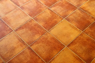 Closeup of square terracotta ceramic tile floor background clipart