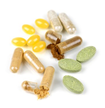 Mix of herbal supplements and vitamin pills isolated on white clipart