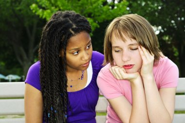 Teenager consoling her friend clipart