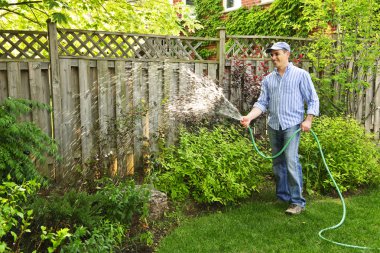 Man watering garden clipart