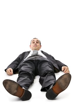 Businessman laying down on white background clipart