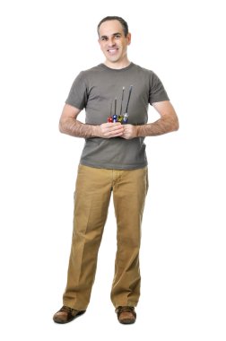 Smiling handyman holding a bunch of screwdrivers clipart