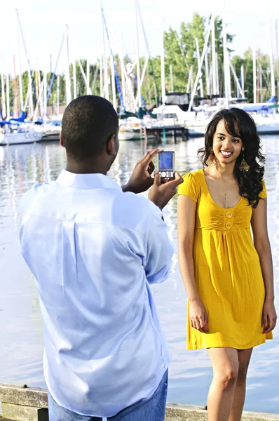 Woman posing for picture near boats — Stock Photo, Image
