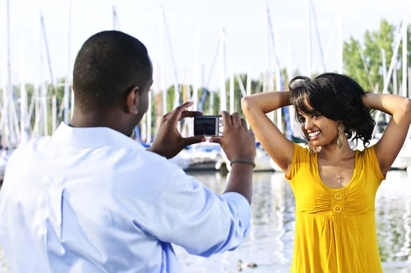 Woman posing for picture near boats — Stock Photo, Image