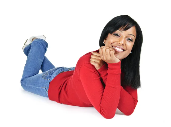 Smiling young woman relaxing laying down — Stock Photo, Image
