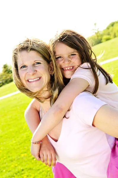 Mother and daughter piggyback — Stock Photo, Image