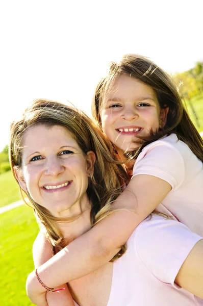 Mother and daughter piggyback — Stock Photo, Image