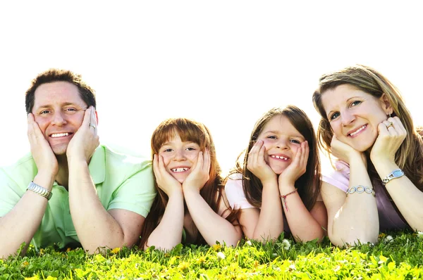 快乐的四人家庭铺设休息头手上的画像 — 图库照片