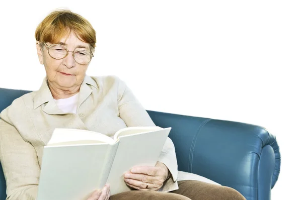 Elderly Woman Relaxing Couch Reading Book — Stockfoto