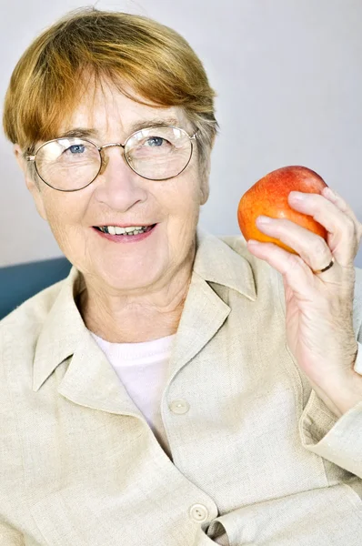Elderly Woman Eating Healthy Holding Nutritious Apple — Stock Photo, Image