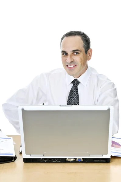 Empresário em sua mesa no fundo branco — Fotografia de Stock