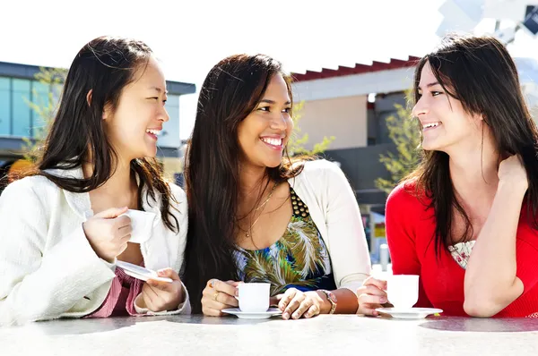 Three Girl Friends Sitting Having Drinks Outdoor Mall Stock Picture