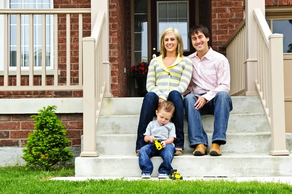 Young Family Sitting Front Steps House Royalty Free Stock Photos