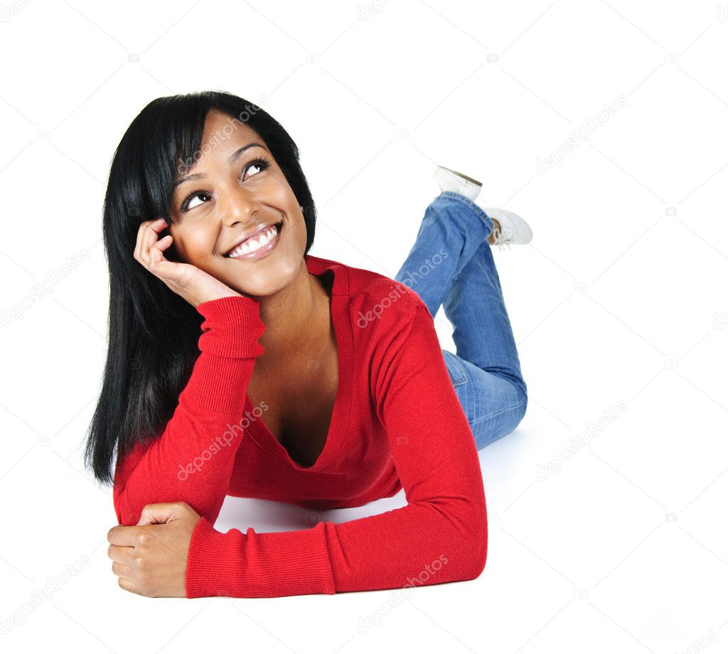 Smiling young woman relaxing looking up
