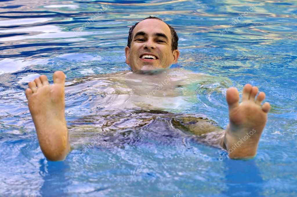 Man swimming in pool — Stock Photo © elenathewise 4719823