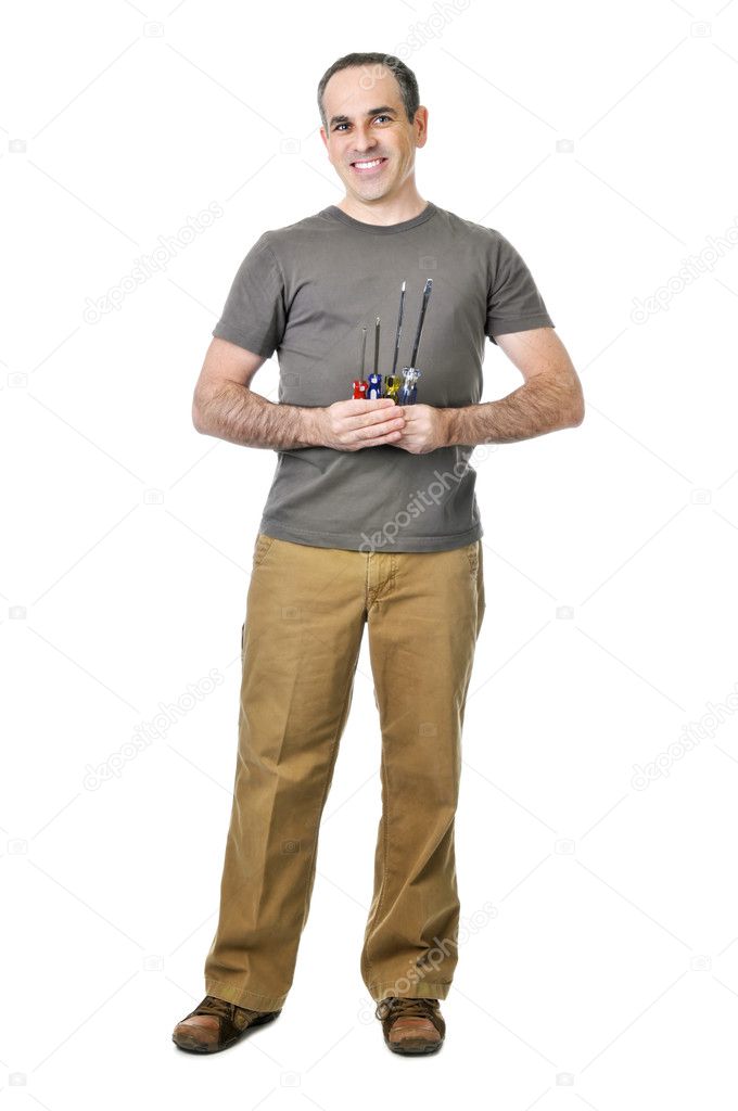 Smiling handyman holding a bunch of screwdrivers