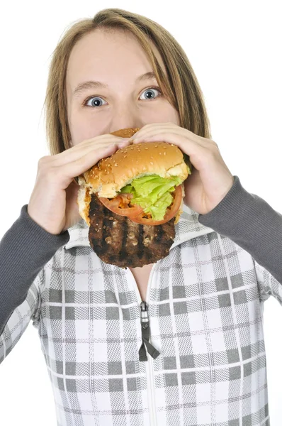 Tizenéves Lány Eszik Egy Nagy Hamburger Elszigetelt Fehér Background — Stock Fotó