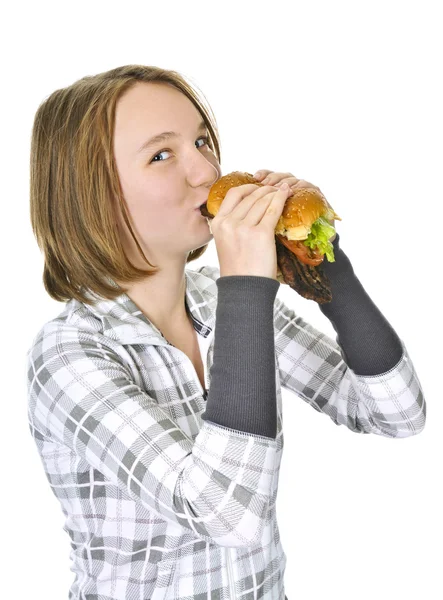 Adolescente chica sosteniendo hamburguesa grande — Foto de Stock