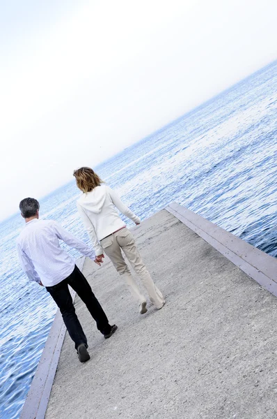 Mature romantic couple on a pier — Stock Photo, Image