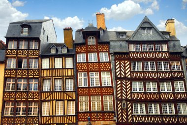 Row of crooked medieval houses in Rennes, France. clipart