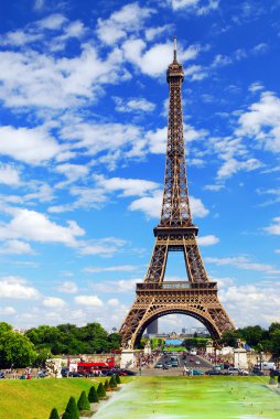 Eiffel tower on background of blue sky in Paris, France. clipart