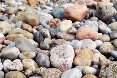 Background of colofrul beach pebbles of different shape and size clipart