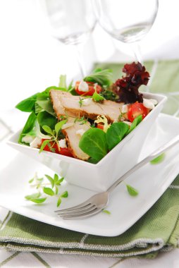 Fresh green salad with grilled chicken herbs and tomatoes clipart