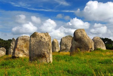 Prehistoric megalithic monuments menhirs in Carnac area in Brittany, France clipart