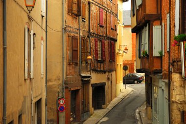 Narrow medieval street in town of Albi in south France clipart