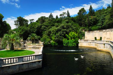 Park Jardin de la Fontaine in city of Nimes in southern France clipart