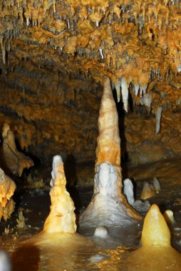 Rock formations inside of a cave in Dordogne region, France clipart