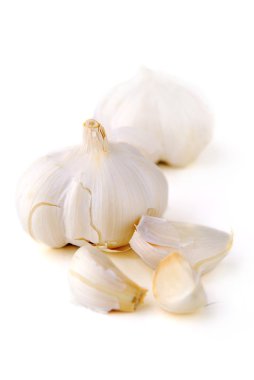 Bulbs and cloves of garlic isolated on white background clipart