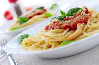 Pasta with tomato sauce basil and grated parmesan clipart