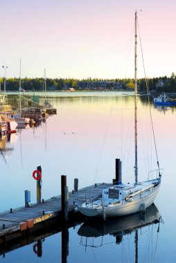 Yacht at sunrise clipart