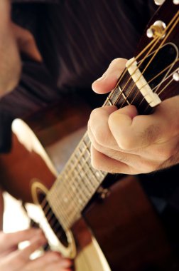 Man playing a guitar clipart