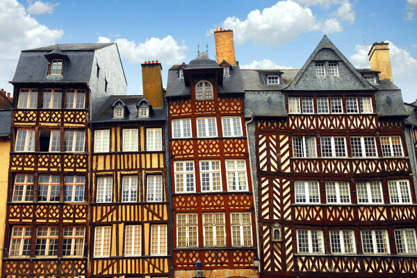 Row of crooked medieval houses in Rennes, France.