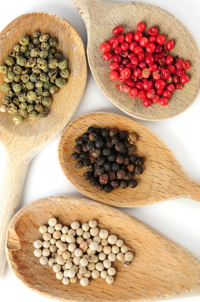 Four Kinds Peppercorns Wooden Cooking Spoons — Stock Photo, Image