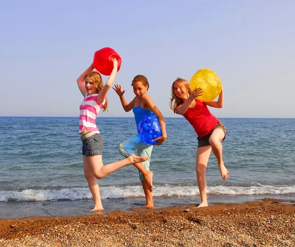 Three Girls Sandy Beach Being Silly Colorful Balls — Stock Photo, Image