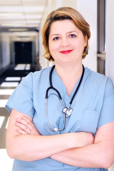 Portrait Smiling Nurse Standing Hospital Corridor — Stock Photo, Image