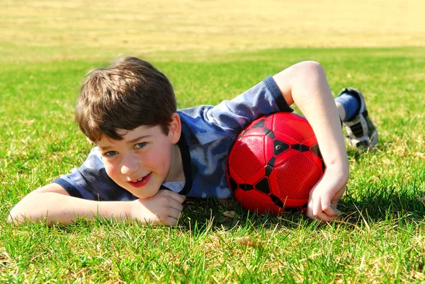 Cute smiling little boy lying on the grass Stock Photos, Royalty Free ...