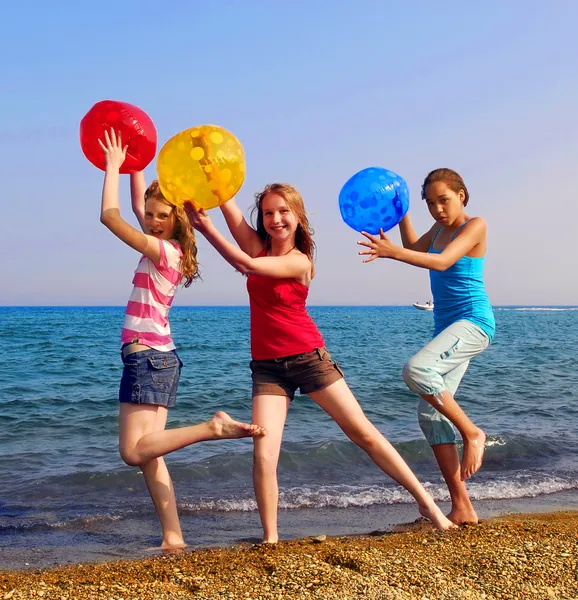 depositphotos_4826002-stock-photo-three-girls-colorful-beach-balls.jpg