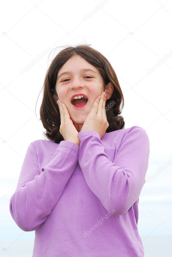 Portrait of a young girl with happy and surprised face
