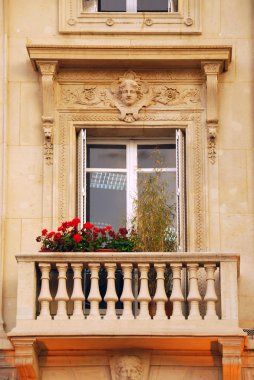 Old window with balcony and flower boxes in Paris France clipart