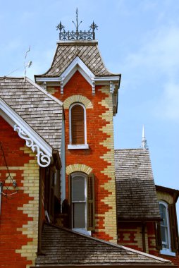 Fragment of a beautiful red brick victorian house clipart