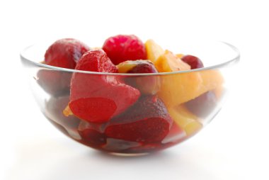 Serving of fruit salad on white background clipart