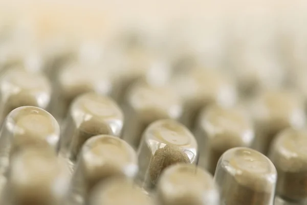 stock image Background of herbal supplement pills close up