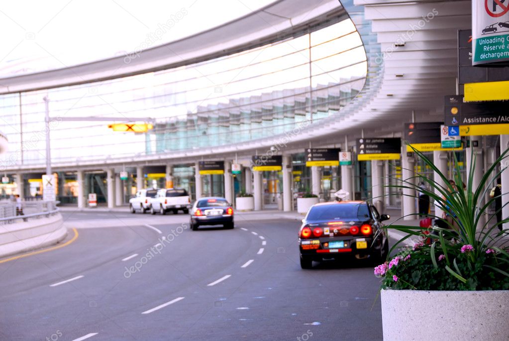 Airport terminal with cars outside