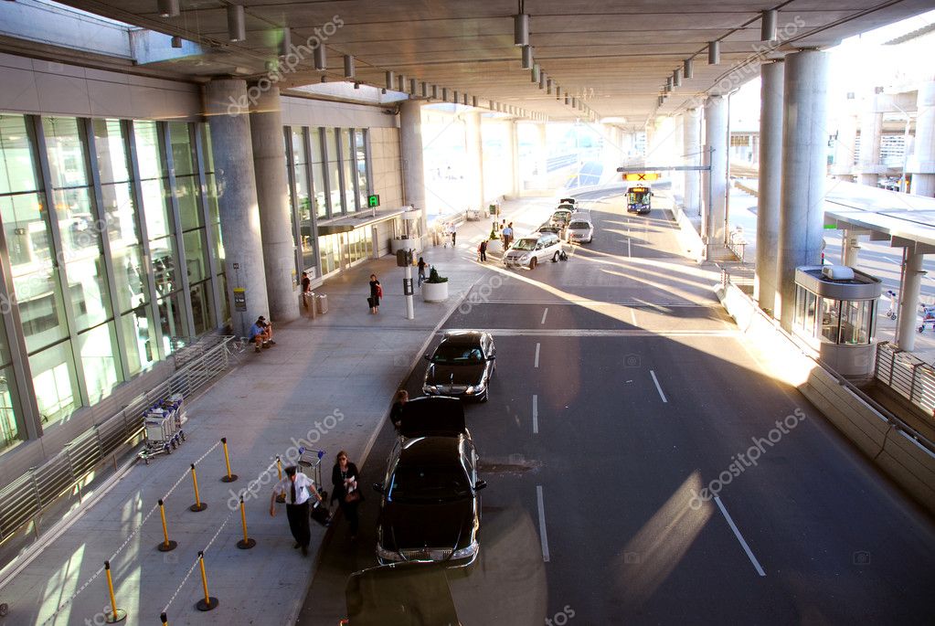 Travelers getting taxis at airport